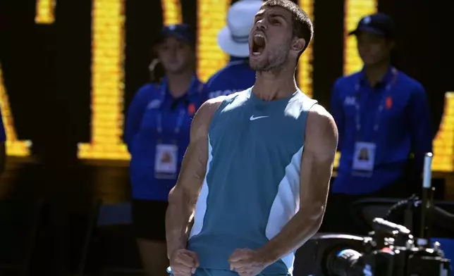 Carlos Alcaraz of Spain reacts after defeating Nuno Borges of Portugal in their third round match at the Australian Open tennis championship in Melbourne, Australia, Friday, Jan. 17, 2025. (AP Photo/Asanka Brendon Ratnayake)