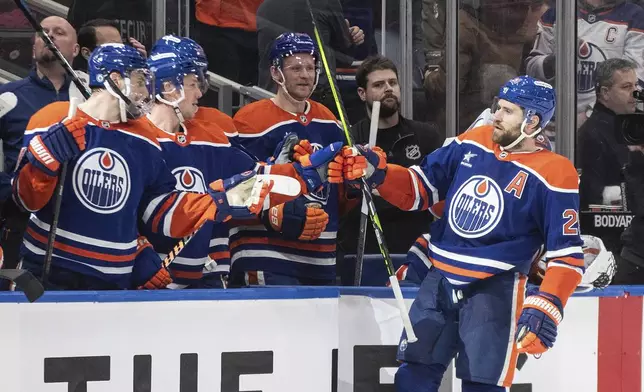 Edmonton Oilers' Leon Draisaitl (29) celebrates a goal against the Utah Hockey Club during the third period of an NHL hockey game in Edmonton, Alberta on Tuesday, Dec. 31, 2024. (Jason Franson/The Canadian Press via AP)