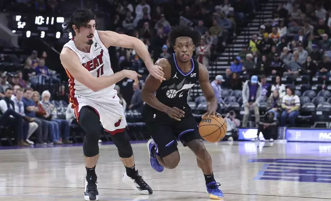 Utah Jazz guard Collin Sexton, right, drives with the ball against Miami Heat guard Jaime Jaquez Jr. (11) during the second half of an NBA basketball game, Thursday, Jan. 9, 2025, in Salt Lake City. (AP Photo/Rob Gray)