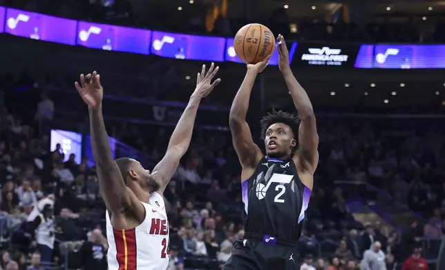 Utah Jazz guard Collin Sexton (2) shoots over Miami Heat forward Haywood Highsmith, left, during the second half of an NBA basketball game, Thursday, Jan. 9, 2025, in Salt Lake City. (AP Photo/Rob Gray)