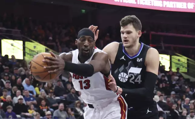 Miami Heat center Bam Adebayo (13) and Utah Jazz center Walker Kessler (24) play for a rebound during the second half of an NBA basketball game, Thursday, Jan. 9, 2025, in Salt Lake City. (AP Photo/Rob Gray)