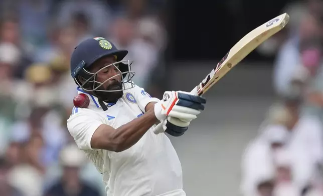 India's Mohammed Siraj reacts as he is hit while batting during play on the first day of the fifth cricket test between India and Australia at the Sydney Cricket Ground, in Sydney, Australia, Friday, Jan. 3, 2025. (AP Photo/Mark Baker)