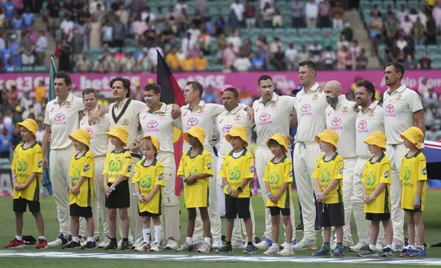 Australia line up for their national anthem ahead of play on the first day of the fifth cricket test between India and Australia at the Sydney Cricket Ground, in Sydney, Australia, Friday, Jan. 3, 2025. (AP Photo/Mark Baker)