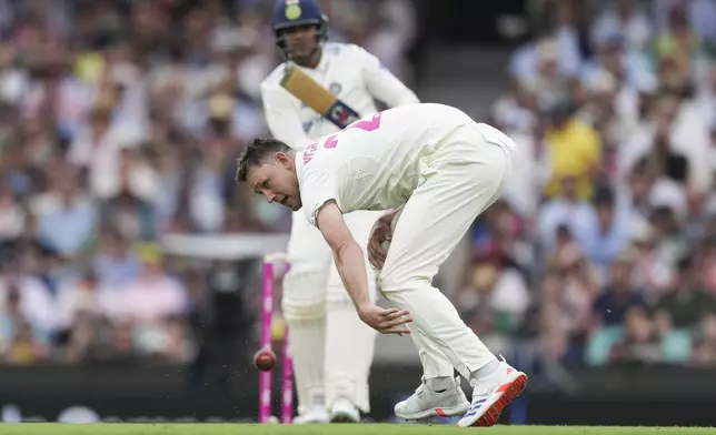 Australia's Beau Webster attempts to field the ball off his own bowling during play on the first day of the fifth cricket test between India and Australia at the Sydney Cricket Ground, in Sydney, Australia, Friday, Jan. 3, 2025. (AP Photo/Mark Baker)