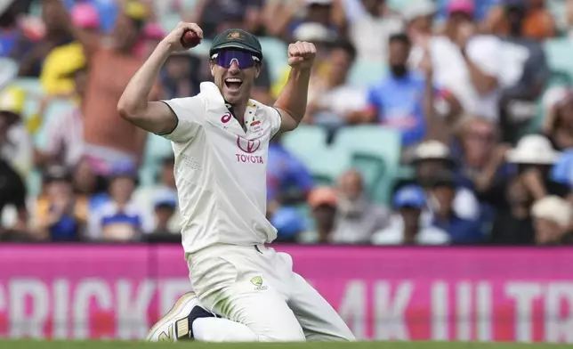 Australia's captain Pat Cummins celebrates after taking a catch to dismiss India's Rishabh Pant during play on the first day of the fifth cricket test between India and Australia at the Sydney Cricket Ground, in Sydney, Australia, Friday, Jan. 3, 2025. (AP Photo/Mark Baker)