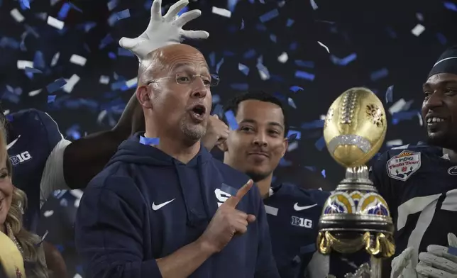 Penn State head coach James Franklin celebrates with his players after the Fiesta Bowl College Football Playoff game against Boise State, Tuesday, Dec. 31, 2024, in Glendale, Ariz. (AP Photo/Rick Scuteri)