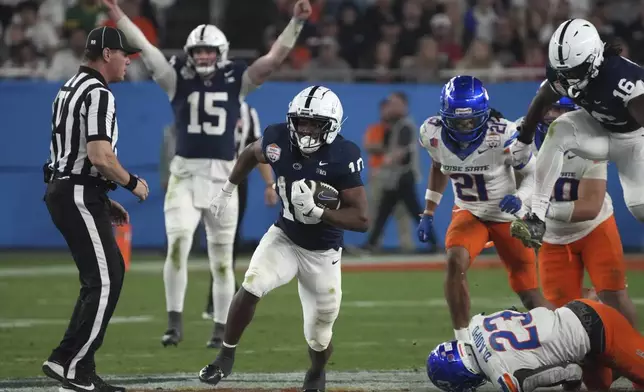 Penn State running back Nicholas Singleton (10) breaks free for a touchdown run against Boise State during the second half of the Fiesta Bowl College Football Playoff game, Tuesday, Dec. 31, 2024, in Glendale, Ariz. (AP Photo/Rick Scuteri)