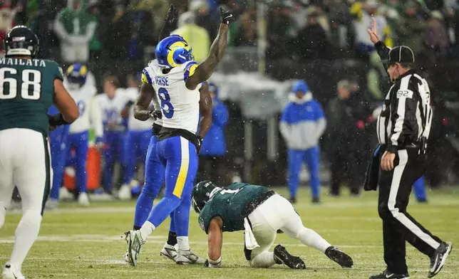 Los Angeles Rams linebacker Jared Verse (8) celebrates sacking Philadelphia Eagles quarterback Jalen Hurts (1) during the first half of an NFL football NFC divisional playoff game Sunday, Jan. 19, 2025, in Philadelphia. (AP Photo/Chris Szagola)