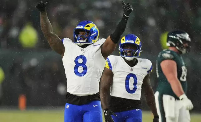 Los Angeles Rams linebacker Jared Verse (8) celebrates sacking Philadelphia Eagles quarterback Jalen Hurts (1) during the first half of an NFL football NFC divisional playoff game Sunday, Jan. 19, 2025, in Philadelphia. (AP Photo/Chris Szagola)