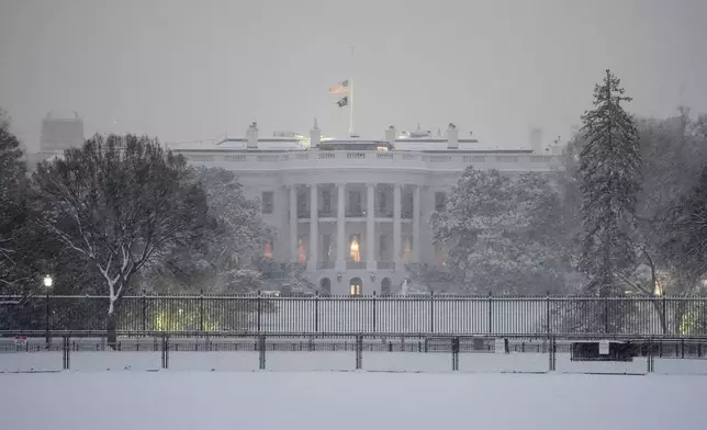 The White House is pictured during a winter snow storm in Washington, Monday, Jan. 6, 2025. (AP Photo/Matt Rourke)