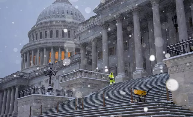 Snow falls at the Capitol ahead of a joint session of Congress to certify the votes from the Electoral College in the presidential election, in Washington, Monday, Jan. 6, 2025. (AP Photo/J. Scott Applewhite)