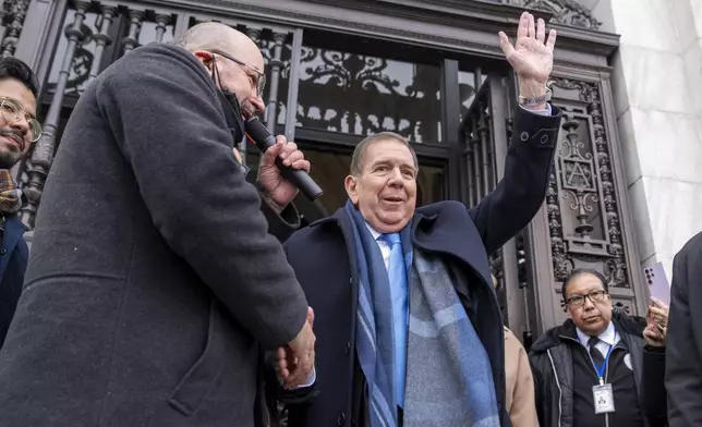 Edmundo Gonzalez, who represented Venezuela's main opposition coalition in the July presidential election, waves as he arrives to address a gathering of supporters outside of the Organization of American States, Monday, Jan. 6, 2025, in Washington. (AP Photo/Jacquelyn Martin)