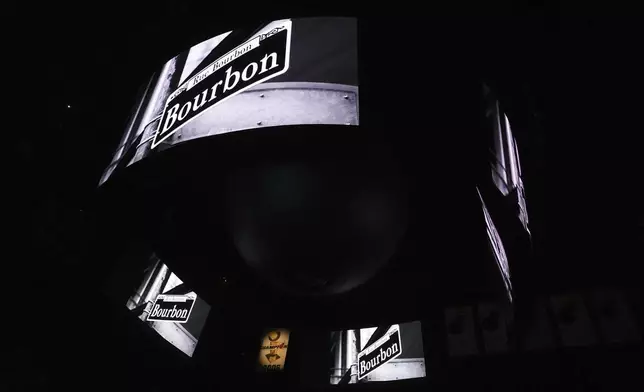 Signage for Bourbon Street is displayed on the scoreboard at the Kaseya Center as a tribute for people killed after a vehicle drove into a crowd in New Orleans before an NBA basketball game between the Miami Heat and the New Orleans Pelicans, Wednesday, Jan. 1, 2025, in Miami. (AP Photo/Lynne Sladky)