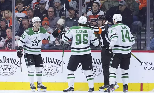 Dallas Stars' Wyatt Johnston (53), Matt Duchene (95) and Jamie Benn (14) celebrate after Johnston's goal during the second period of an NHL hockey game against the Philadelphia Flyers, Thursday, Jan. 9, 2025, in Philadelphia. (AP Photo/Matt Slocum)