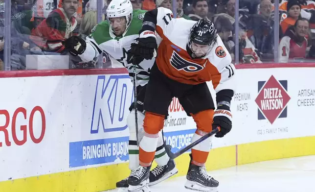 Philadelphia Flyers' Travis Konecny (11) and Dallas Stars' Ilya Lyubushkin (46) collide during the second period of an NHL hockey game, Thursday, Jan. 9, 2025, in Philadelphia. (AP Photo/Matt Slocum)