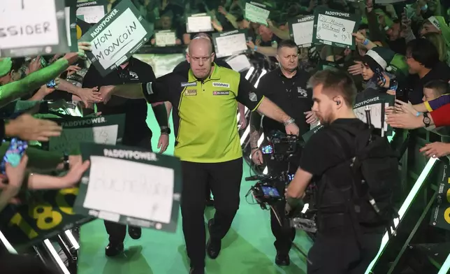 Michael van Gerwen of the Netherlands arrives for the final of the World Darts Championship at Alexandra Palace in London, Friday, Jan. 3, 2025. (AP Photo/Kirsty Wigglesworth)