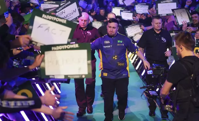 Luke Littler of England arrives for the final of the World Darts Championship at Alexandra Palace in London, Friday, Jan. 3, 2025. (AP Photo/Kirsty Wigglesworth)