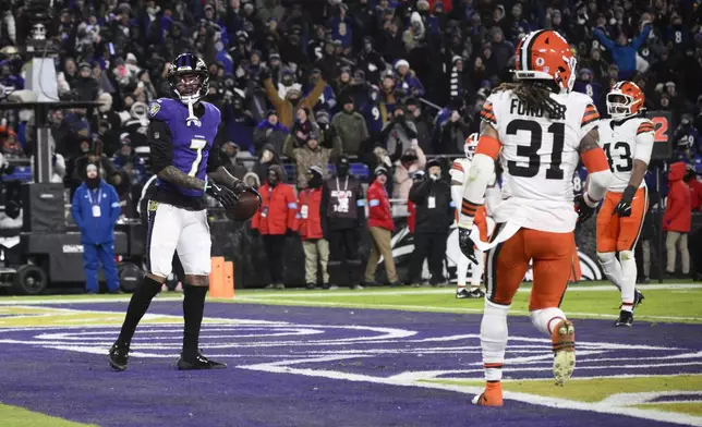 Baltimore Ravens wide receiver Rashod Bateman (7) celebrates after catching a 7-yard touchdown pass Cleveland Browns' Mike Ford Jr. (31) and Mohamoud Diabate, right, stand by during the second half of an NFL football game Saturday, Jan. 4, 2025, in Baltimore. (AP Photo/Nick Wass)