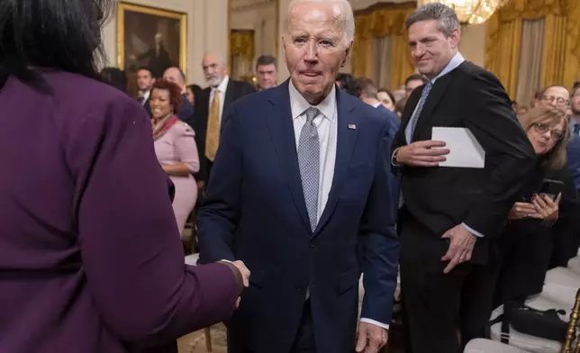 President Joe Biden listens to a reporter's question after an event to award the Presidential Citizens Medal to recipients in the East Room at the White House, Thursday, Jan. 2, 2025, in Washington. (AP Photo/Mark Schiefelbein)