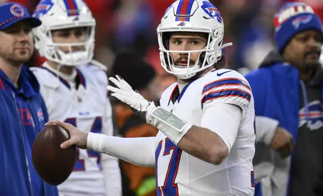 Buffalo Bills quarterback Josh Allen (17) warms up before the AFC Championship NFL football game against the Kansas City Chiefs, Sunday, Jan. 26, 2025, in Kansas City, Mo. (AP Photo/Reed Hoffmann)
