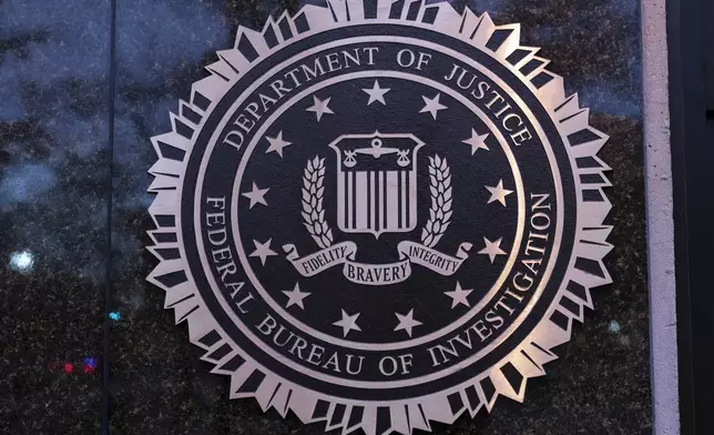 FILE - The seal of theFederal Bureau of Investigation (FBI) is seen on the Headquarters in Washington, Saturday, Dec. 7, 2024. (AP Photo/Jose Luis Magana, File)