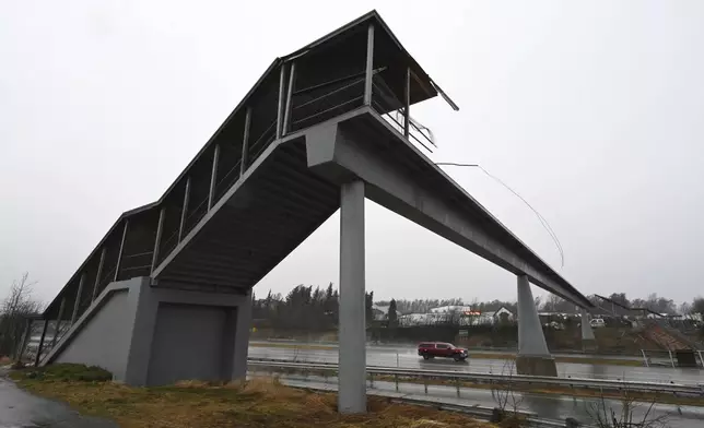 A pedestrian bridge spanning the Seward Highway was damaged during the windstorm on Sunday, Jan. 12, 2025. (Bill Roth/Anchorage Daily News via AP)