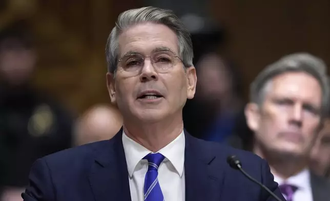 Scott Bessent, President-elect Donald Trump's choice to be Secretary of the Treasury, appears before the Senate Finance Committee for his confirmation hearing, at the Capitol in Washington, Thursday, Jan. 16, 2025. (AP Photo/Ben Curtis)