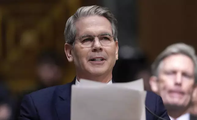 Scott Bessent, President-elect Donald Trump's choice to be Secretary of the Treasury, appears before the Senate Finance Committee for his confirmation hearing, at the Capitol in Washington, Thursday, Jan. 16, 2025. (AP Photo/Ben Curtis)