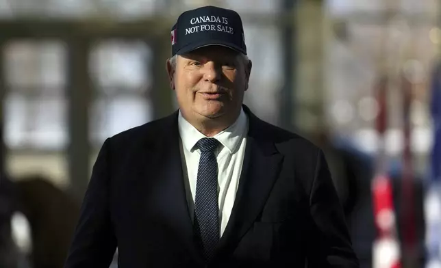 Ontario Premier Doug Ford arrives for a first ministers meeting in Ottawa on Wednesday, Jan.15, 2025. (Sean Kilpatrick/The Canadian Press via AP)