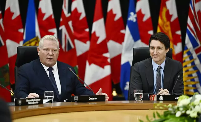 Ontario Premier Doug Ford, left, speaks, as Prime Minister Justin Trudeau looks on during a first ministers meeting in Ottawa on Wednesday, Jan. 15, 2025. (Justin Tang/The Canadian Press via AP)