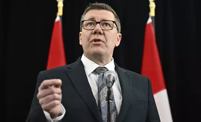 Saskatchewan Premier Scott Moe speaks as he arrives for a first ministers meeting in Ottawa on Wednesday, Jan. 15, 2025. (Justin Tang/The Canadian Press via AP)