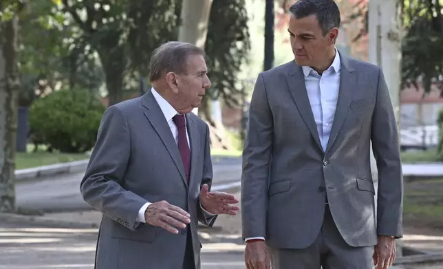 FILE - In this photo provided by the Spanish government in Madrid, exiled Venezuelan opposition leader Edmundo Gonzalez, left, walks with Spain's Prime Minister Pedro Sanchez outside the Moncloa Palace in Madrid, Thursday Sept. 12, 2024. (Fernando Calvo, Spanish Government via AP, File)