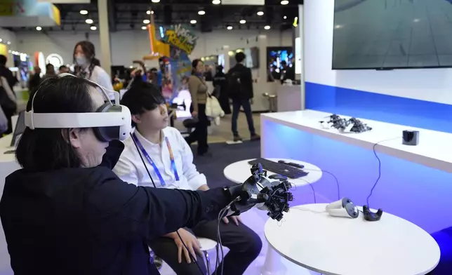 A Kurimoto MRF glove is shown at a Kurimoto booth during the CES tech show Tuesday, Jan. 7, 2025, in Las Vegas. (AP Photo/Abbie Parr)