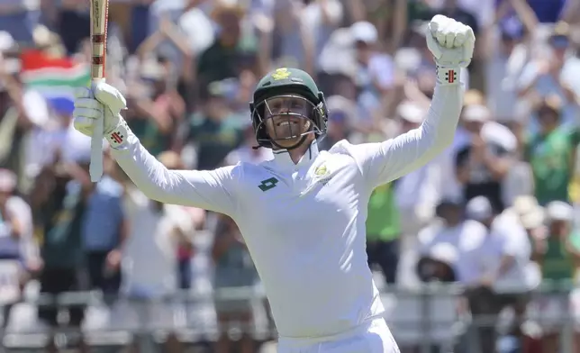 South Africa's Kyle Verreynne celebrates his 100 during the second day of the second test match between South Africa and Pakistan in Cape Town, South Africa, Saturday, Jan. 4, 2025. (AP Photo/Halden Krog)