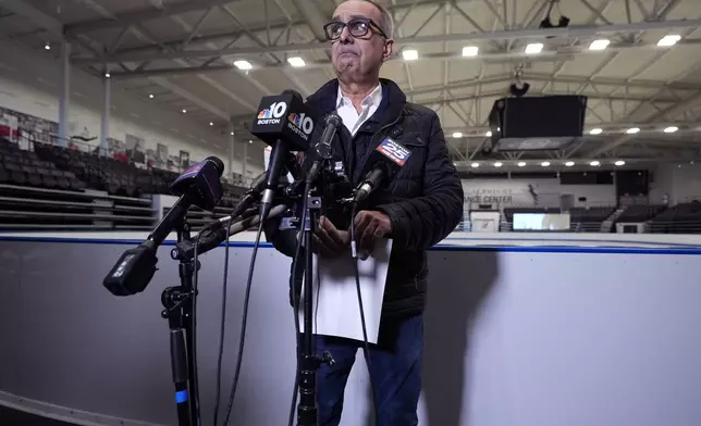 Doug Zeghibe, CEO and Executive Director of The Skating Club of Boston, pauses while announcing that six athletes, coaches and family are believed to have perished in the collision of a passenger aircraft and military helicopter in Washington, at the club's figure skating rink, Thursday, Jan. 30, 2025, in Norwood, Mass. (AP Photo/Charles Krupa)