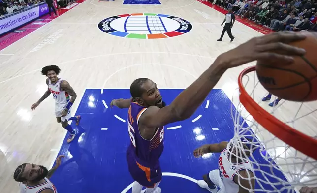 Phoenix Suns' Kevin Durant dunks during the first half of an NBA basketball game against the Philadelphia 76ers, Monday, Jan. 6, 2025, in Philadelphia. (AP Photo/Matt Slocum)