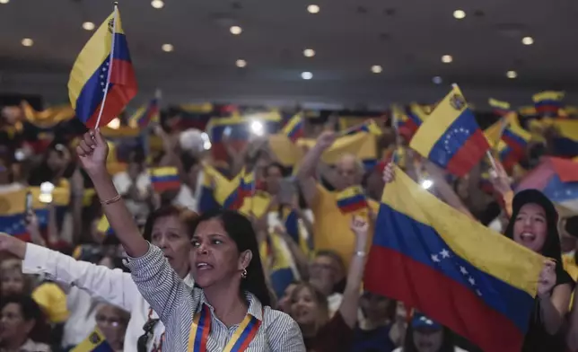 Supporters of Venezuela's opposition leader Edmundo Gonzalez gather during a meeting in Panama City, Wednesday, Jan. 8, 2025. (AP Photo/Agustin Herrera)