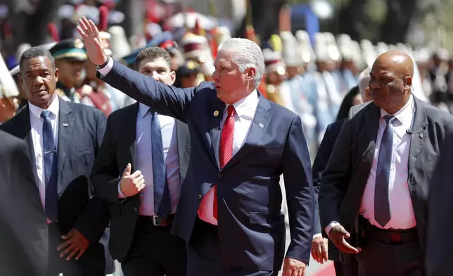 Cuba's President Miguel Diaz-Canel waves after the swearing-in ceremony of Venezuelan President Nicolas Maduro for a third term at the National Assembly in Caracas, Venezuela, Friday, Jan. 10, 2025. (AP Photo/Cristian Hernandez)