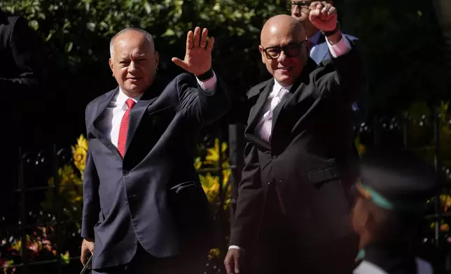 Venezuelan Interior Minister Diosdado Cabello, left, and National Assembly President Jorge Rodriguez arrive at the Assembly for the inauguration of President Nicolas Maduro for his third term in Caracas, Venezuela, Friday, Jan. 10, 2025. (AP Photo/Matias Delacroix)