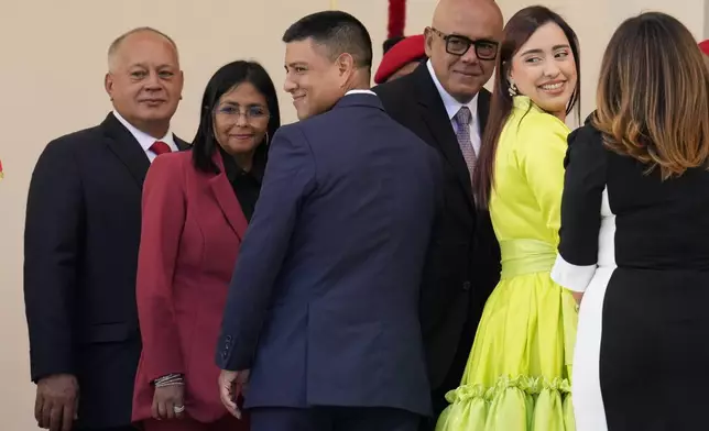 Government officials, from left, Interior Minister Diosdado Cabello, Vice President Delcy Rodriguez, National Assembly Vice President Pedro Infante, National Assembly President Jorge Rodriguez, and National Assembly Second Vice President America Perez arrive for the swearing-in ceremony of President Nicolas Maduro for his third term in Caracas, Venezuela, Friday, Jan. 10, 2025. (AP Photo/Ariana Cubillos)