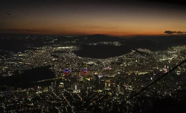 Night falls on Caracas, Venezuela, as seen from El Avila, Wednesday, Jan. 8, 2025, days ahead of President Nicolas Maduro's inauguration for a third presidential term. (AP Photo/Matias Delacroix)