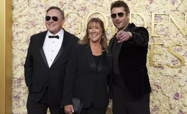 Glen Powell Sr., from left, Cyndy Powell, and Glen Powell arrive at the 82nd Golden Globes on Sunday, Jan. 5, 2025, at the Beverly Hilton in Beverly Hills, Calif. (Photo by Jordan Strauss/Invision/AP)