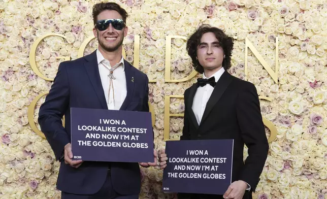 Max Braunstein, left, and Miles Mitchell arrive at the 82nd Golden Globes on Sunday, Jan. 5, 2025, at the Beverly Hilton in Beverly Hills, Calif. (Photo by Jordan Strauss/Invision/AP)