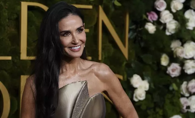 Demi Moore arrives at the 82nd Golden Globes on Sunday, Jan. 5, 2025, at the Beverly Hilton in Beverly Hills, Calif. (Photo by Jordan Strauss/Invision/AP)