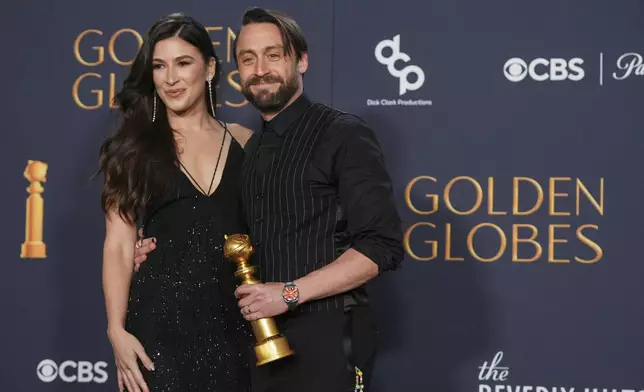 Kieran Culkin, right, winner of the award for best performance by an actor in a supporting role in any motion picture for "A Real Pain" poses with Jazz Charton during the 82nd Golden Globes on Sunday, Jan. 5, 2025, at the Beverly Hilton in Beverly Hills, Calif. (AP Photo/Chris Pizzello)