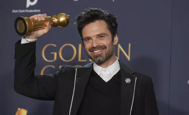 Sebastian Stan poses in the press room with the award for best performance by a male actor in a motion picture - musical or comedy for "A Different Man" during the 82nd Golden Globes on Sunday, Jan. 5, 2025, at the Beverly Hilton in Beverly Hills, Calif. (AP Photo/Chris Pizzello)