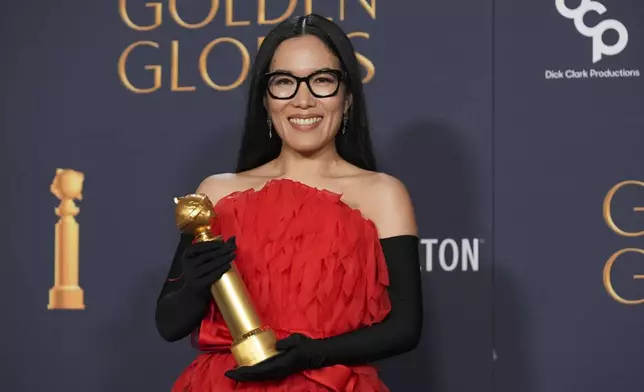 Ali Wong poses in the press room with the award for best performance in stand-up comedy on television for "Ali Wong: Single Lady" during the 82nd Golden Globes on Sunday, Jan. 5, 2025, at the Beverly Hilton in Beverly Hills, Calif. (AP Photo/Chris Pizzello)