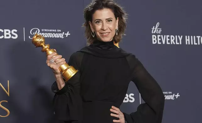 Fernanda Torres poses in the press room with the award for best performance by a female actor in a motion picture - drama for "I'm Still Here" during the 82nd Golden Globes on Sunday, Jan. 5, 2025, at the Beverly Hilton in Beverly Hills, Calif. (AP Photo/Chris Pizzello)