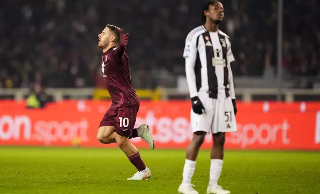 Torino's Nikola Vlasic celebrates after scoring the 1-1 goal for his team during the Italian Serie A soccer match between Torino FC and Juventus, at the Stadio Olimpico Grande Torino, in Turin, Italy, Saturday, Jan. 11, 2025. (Fabio Ferrari/Lapresse via AP)