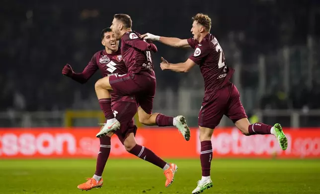 Torino's Nikola Vlasic celebrates after scoring the 1-1 goal for his team during the Italian Serie A soccer match between Torino FC and Juventus, at the Stadio Olimpico Grande Torino, in Turin, Italy, Saturday, Jan. 11, 2025. (Fabio Ferrari/Lapresse via AP)